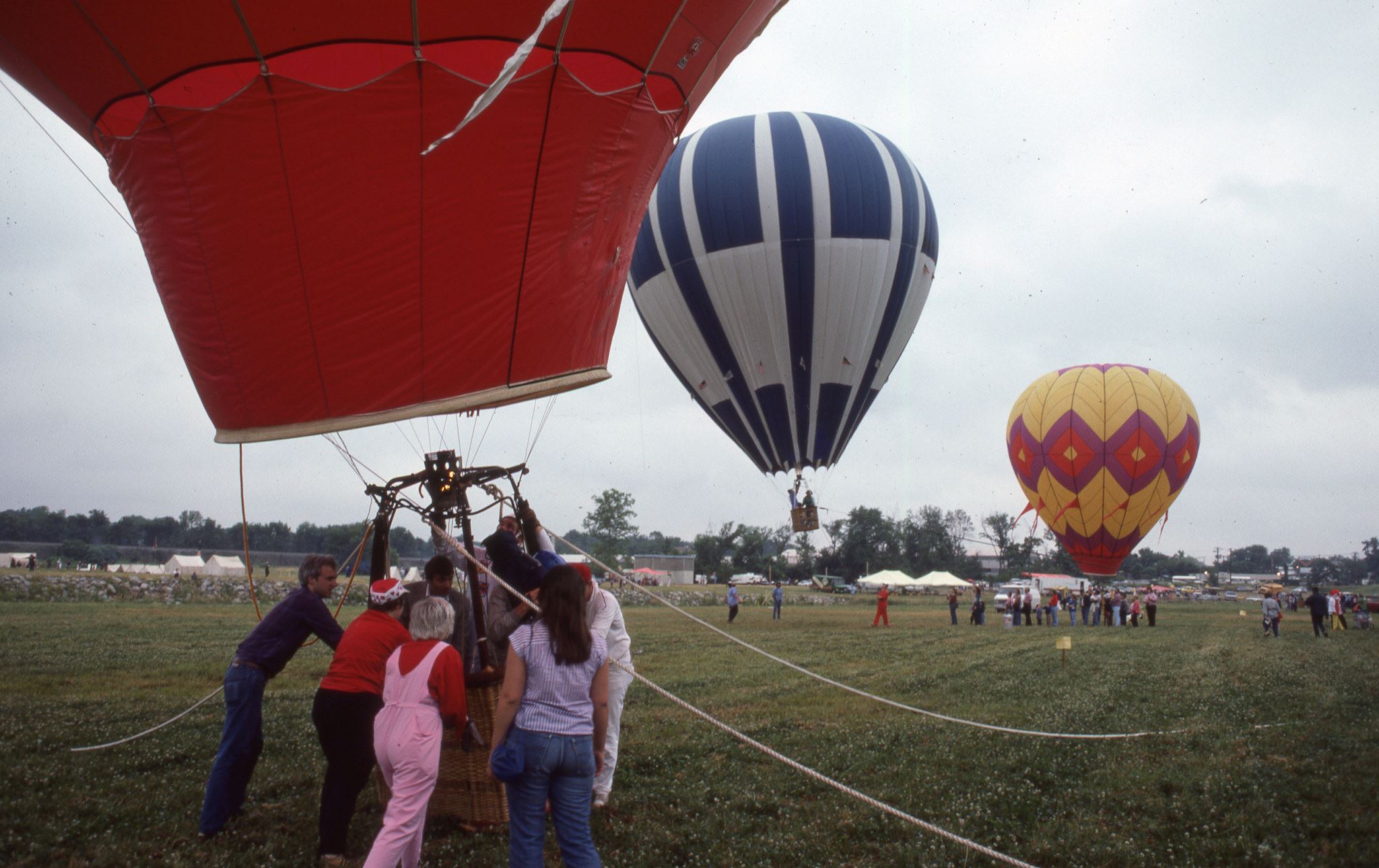 Image of 3 hot air balloons preparing for launch at the Festival of Flight