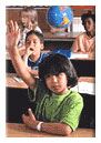 Child Raises Hand in Class