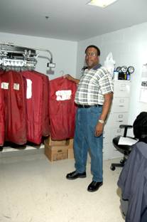 Property clerk receiving inmate clothing