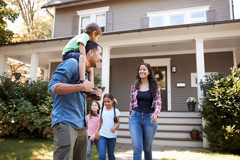 Family Leaving Their House