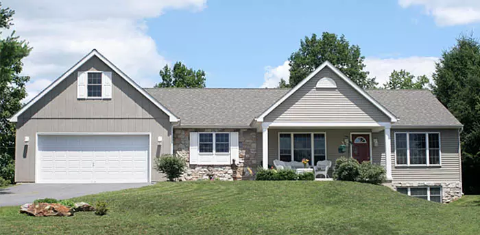 House, gray ranch-style with well-maintained lawn, house and property